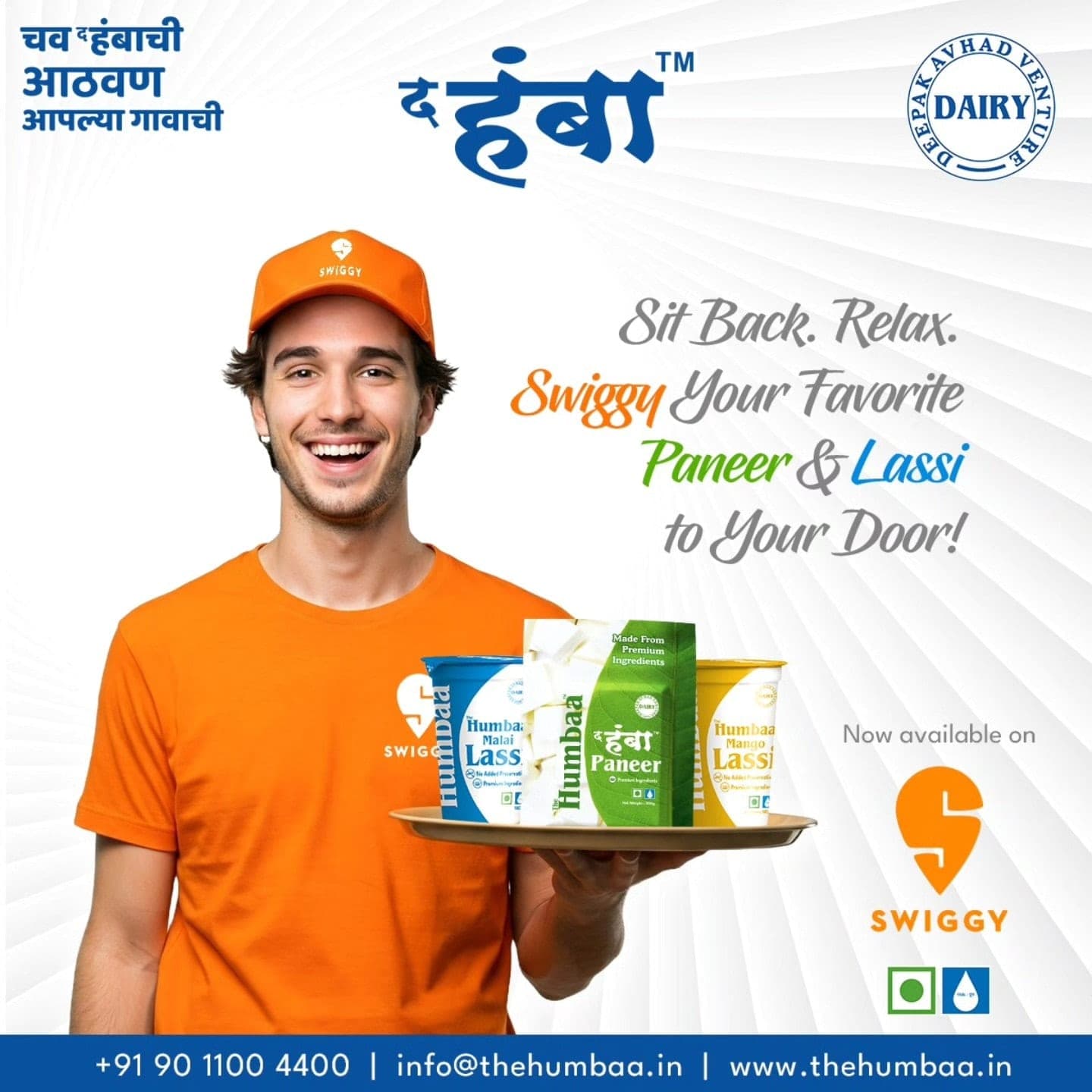 Delivery partner holding The Humbaa Paneer with Malai and Mango Lassi, now available on Swiggy