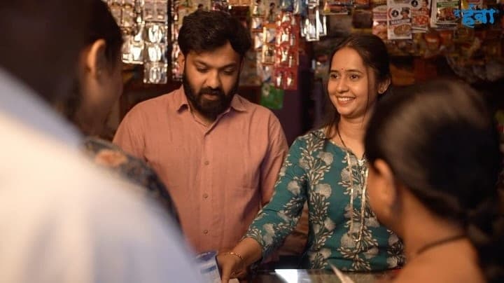 Shopkeepers serving customers in a scene from The Humbaa retail partner campaign